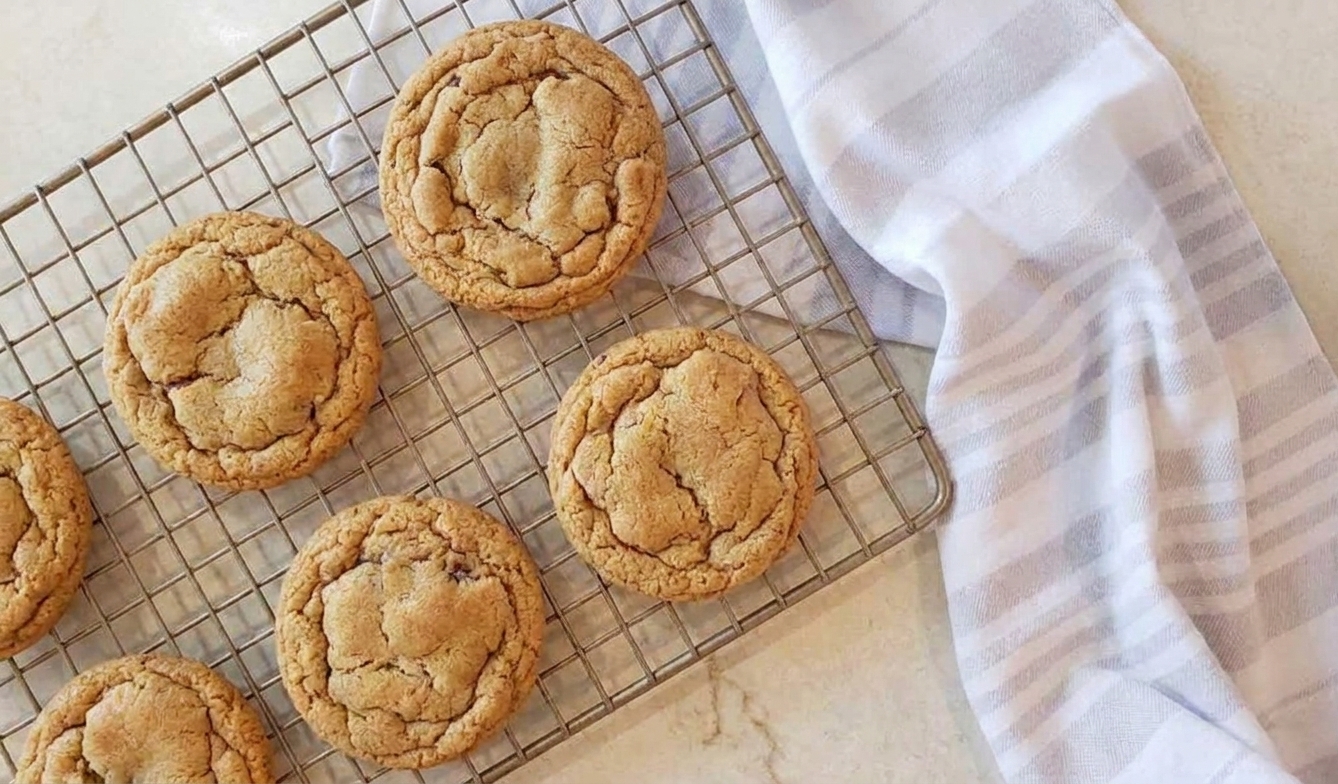 Freshly baked brown sugar cookies cooling on a wire rack